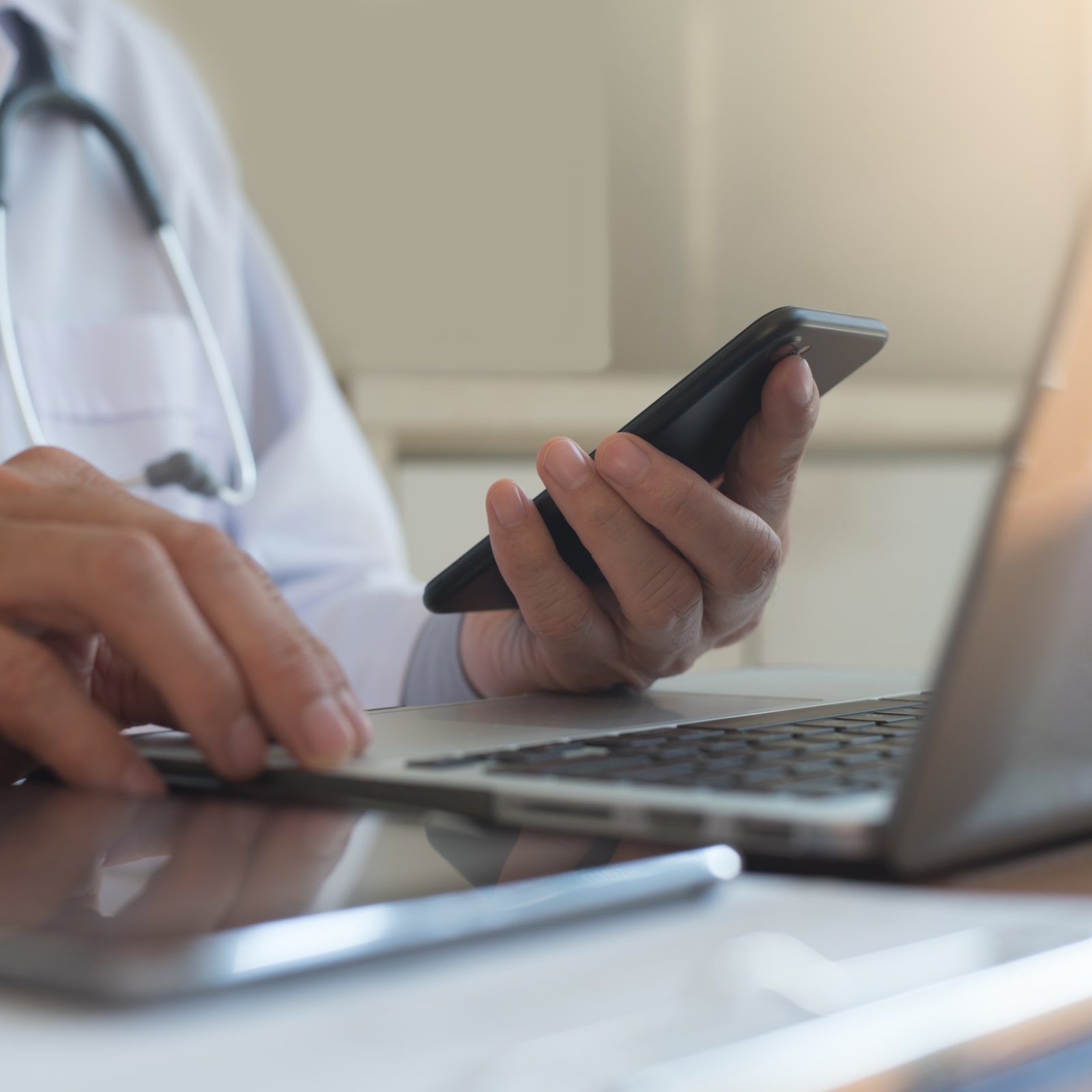 Doctor reviewing patient information on a tablet